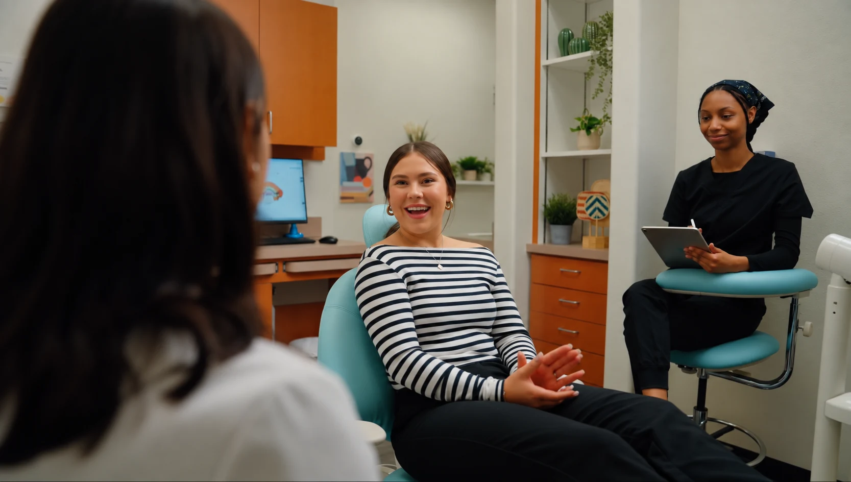 Happy patient discussing cosmetic dentistry options with Dr. Vishala Patel at Edge Dental Designs in McKinney, TX