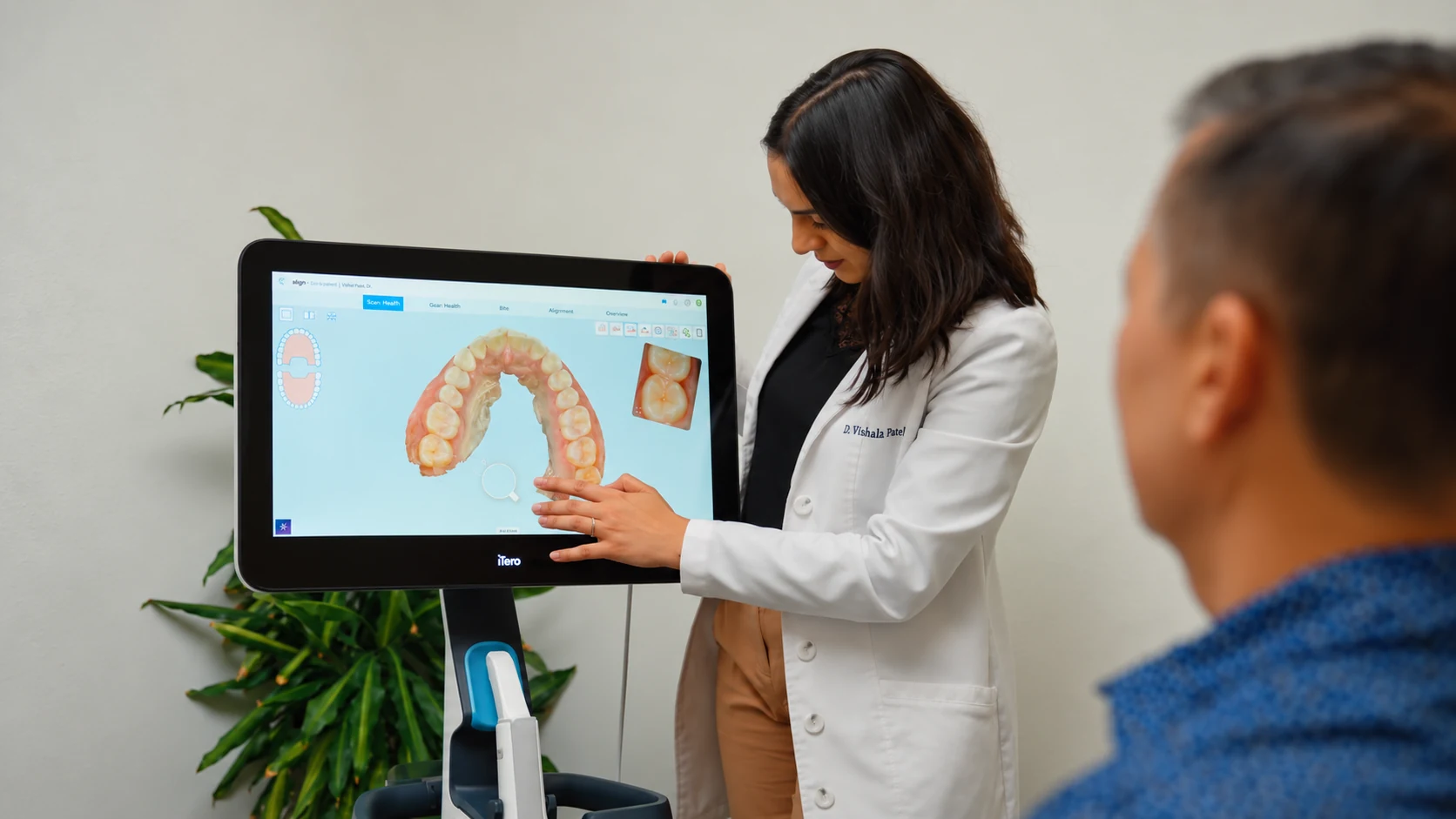 Dr. Vishala Patel reviewing an iTero digital scan for dental crowns with a patient at Edge Dental Designs in McKinney, TX