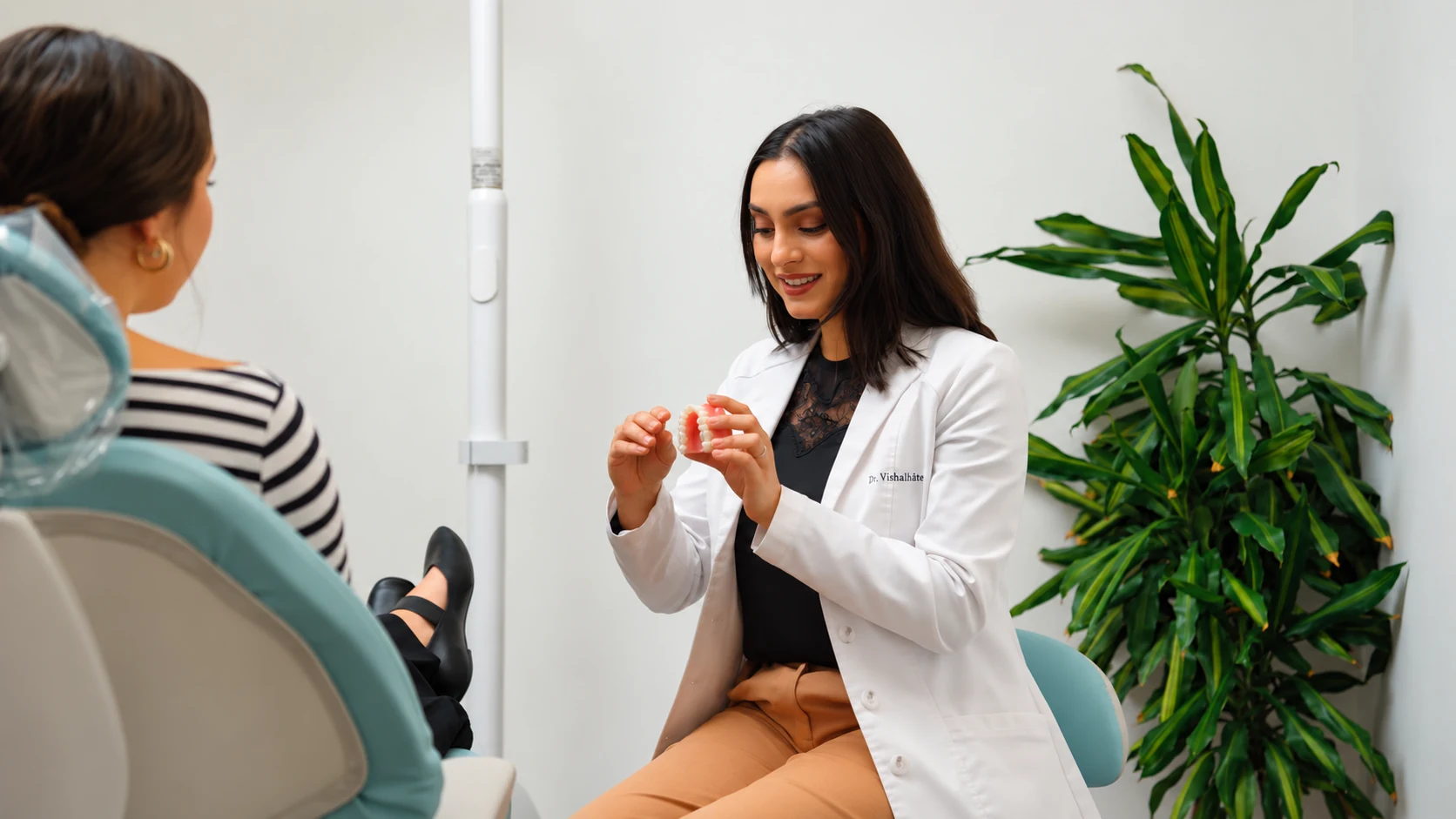 Dr. Vishala Patel talking with a patient about treatment options at Edge Dental Designs in McKinney, TX